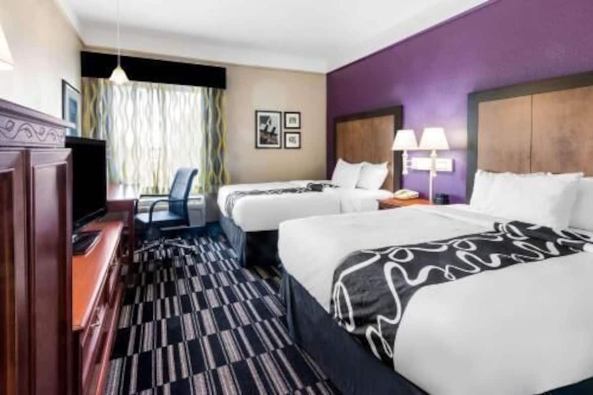 Premium bedding, pillow-top beds, desk, blackout curtains