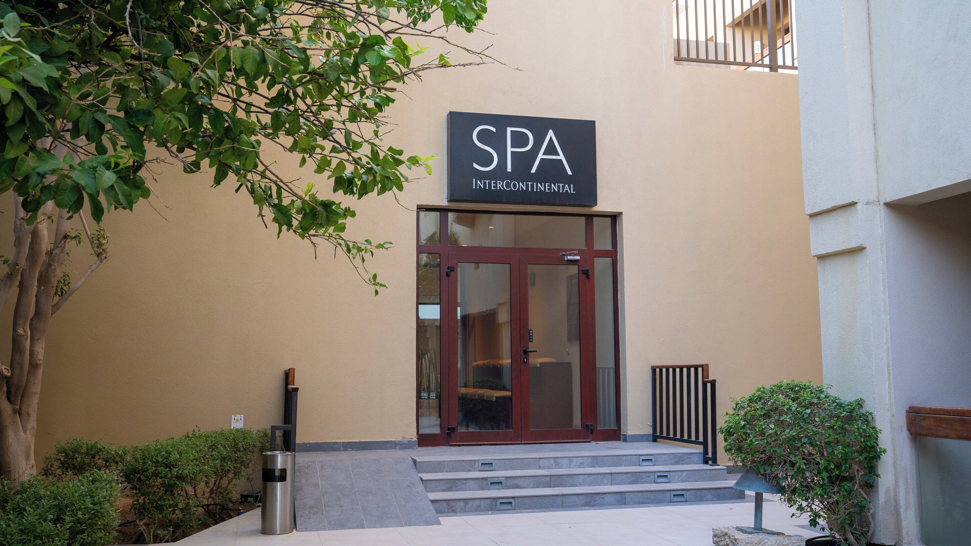 A building with a sign reading "SPA INTERCONTINENTAL" above the entrance.