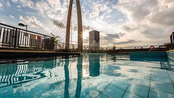 Outdoor pool, open 6 AM to 10 PM, pool umbrellas, pool loungers