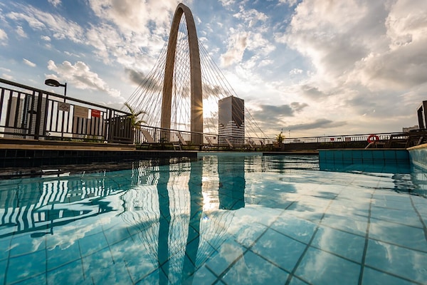 Outdoor pool, open 6 AM to 10 PM, pool umbrellas, sun loungers