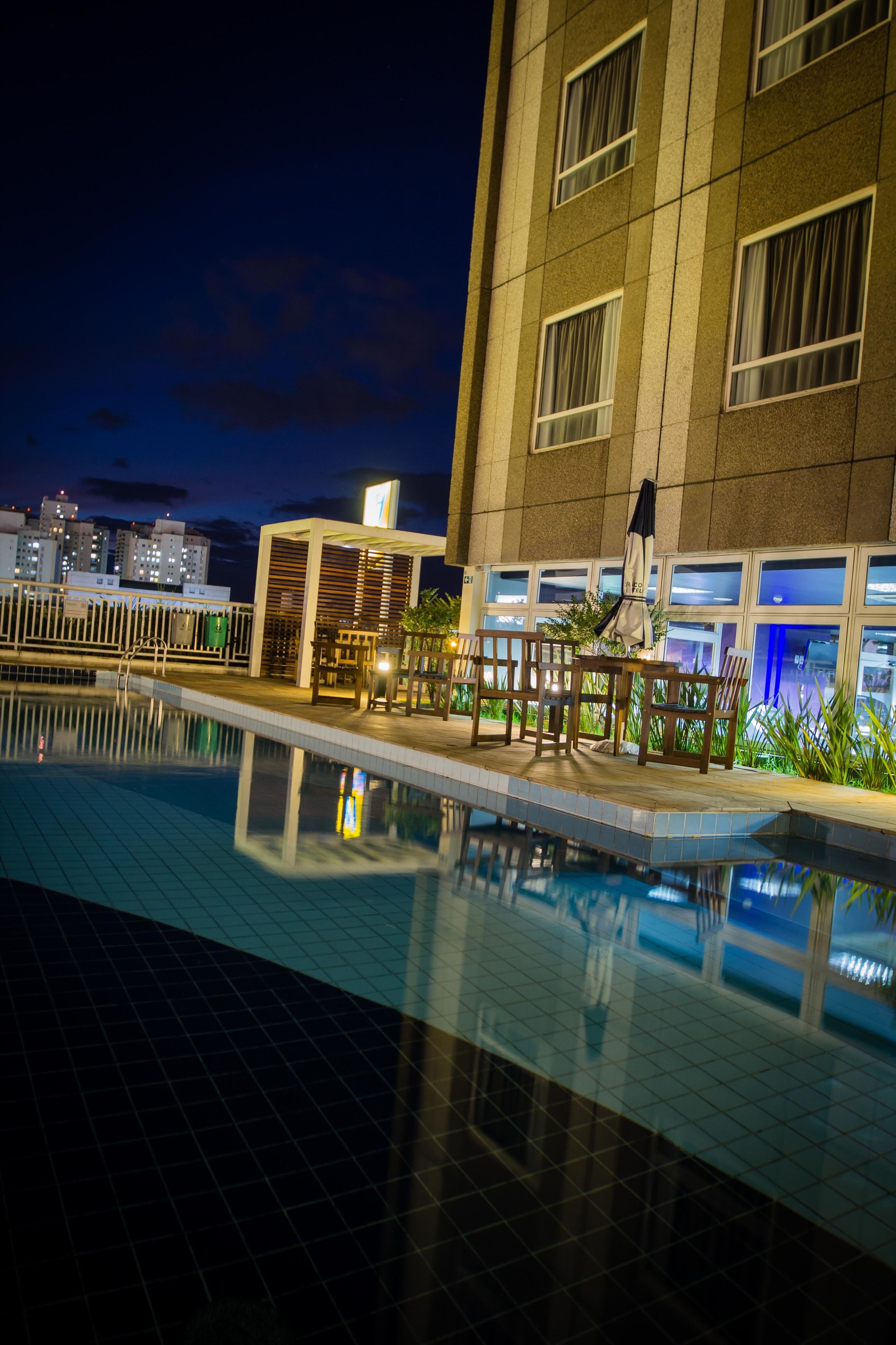 outdoor pool, open 6 am to 10 pm, pool umbrellas, pool loungers
