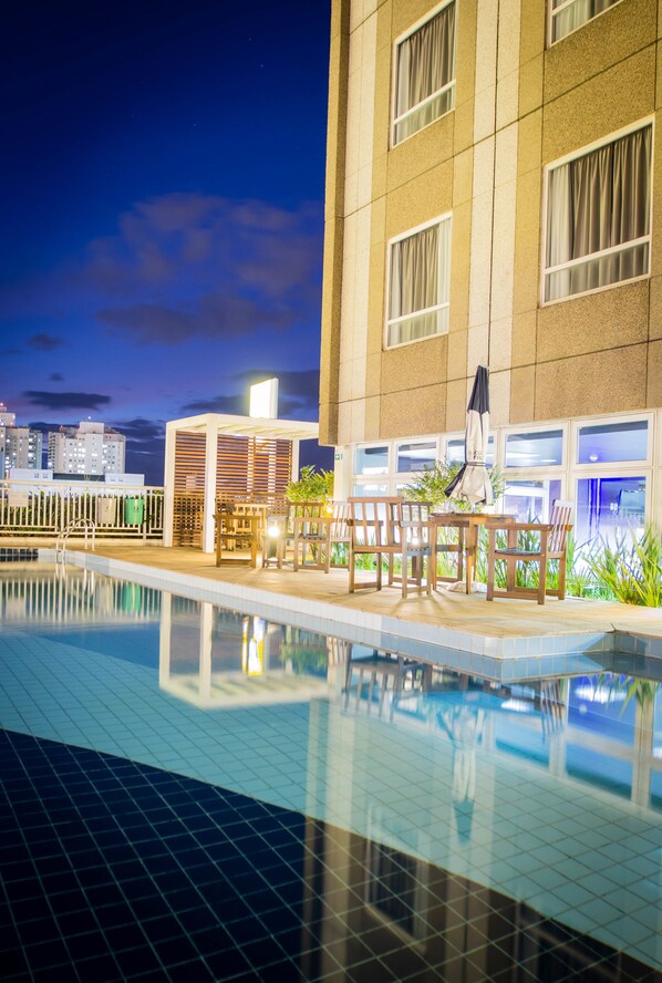 Outdoor pool, open 6 AM to 10 PM, pool umbrellas, pool loungers