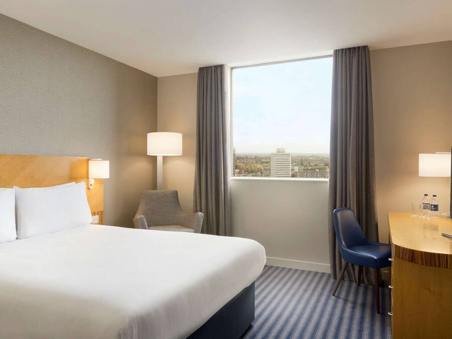 Desk, blackout drapes, iron/ironing board, free cribs/infant beds