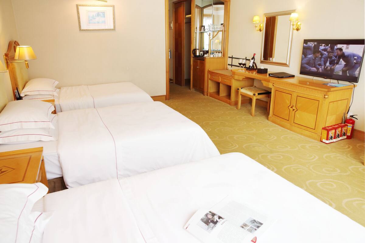 Superior Triple Room | Minibar, in-room safe, desk, blackout drapes