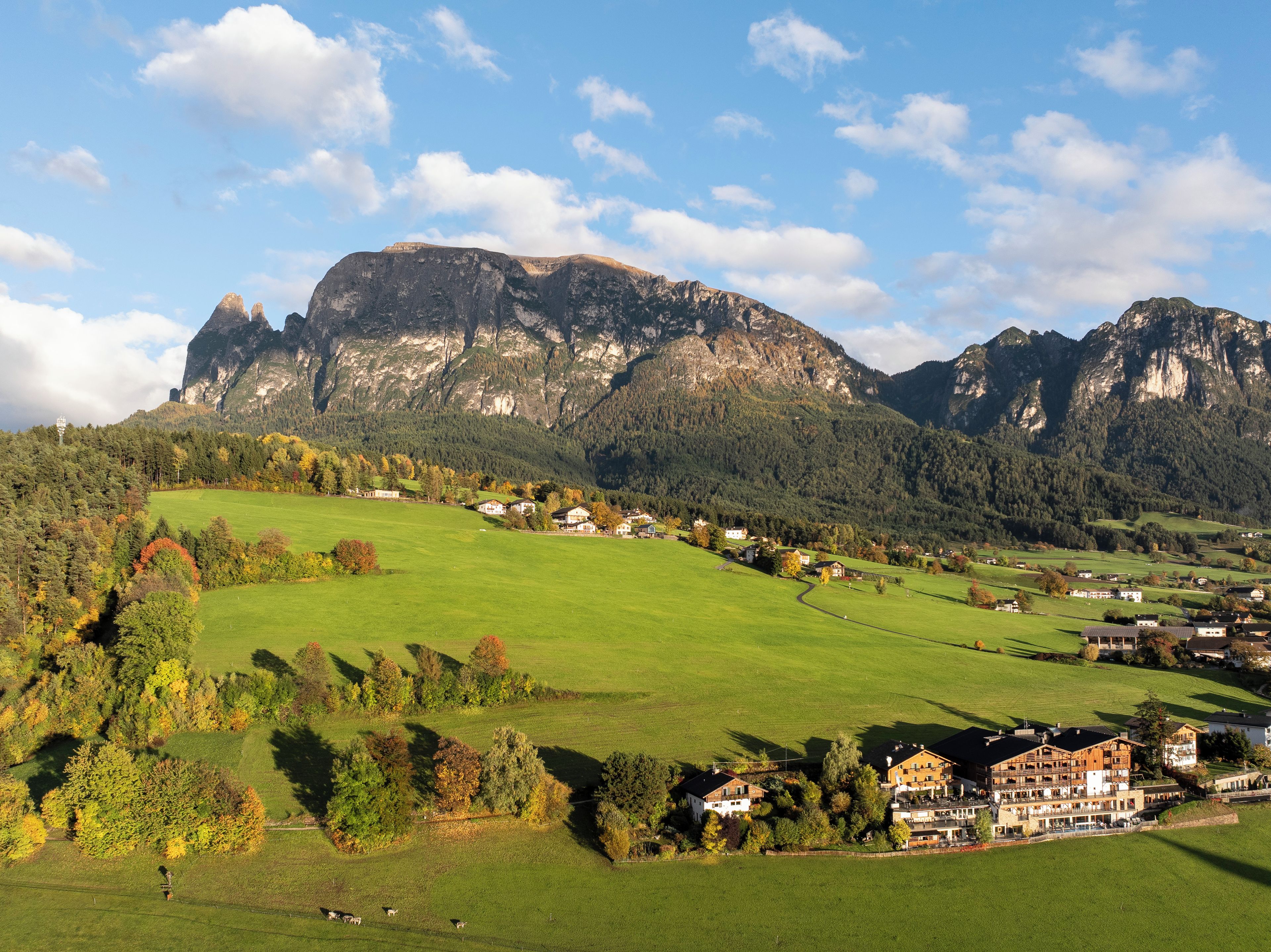 A mountainous landscape with a village and buildings.