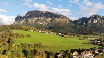 A mountainous landscape with a village and buildings.