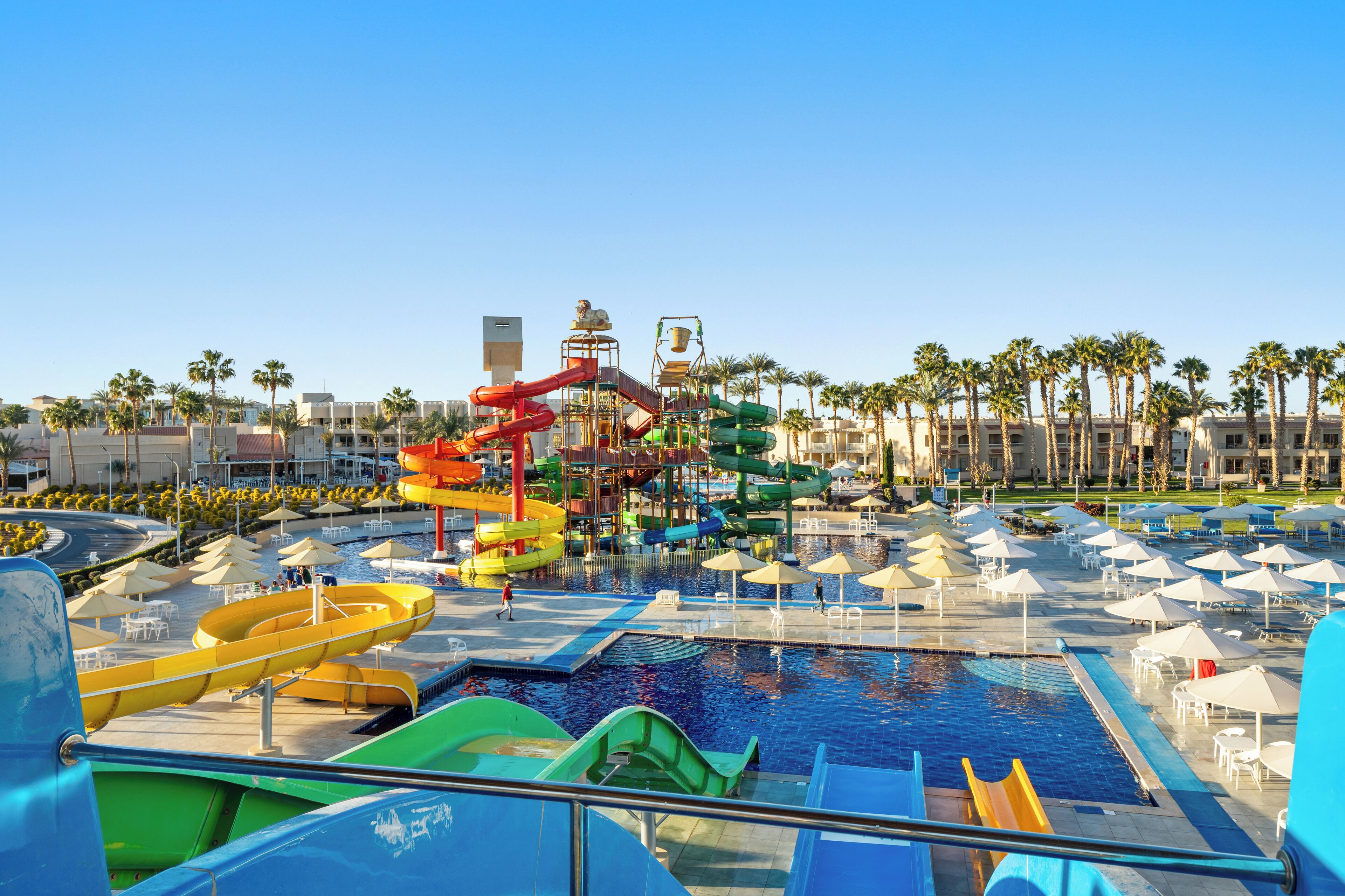 A water park with multiple slides and a pool area.