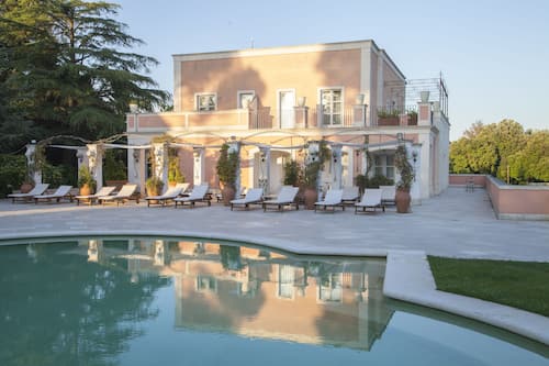 Indoor pool, seasonal outdoor pool, pool umbrellas, pool loungers
