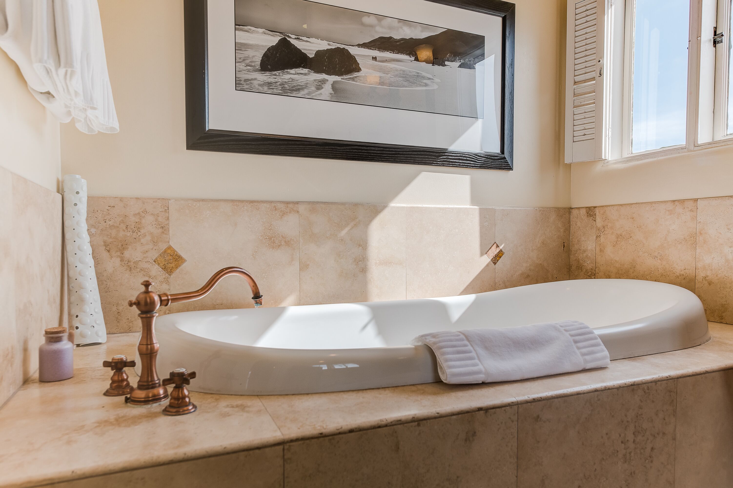 premium room, 1 king bed, partial ocean view | deep-soaking bathtub