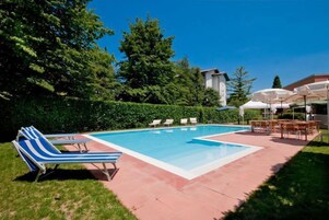 Seasonal outdoor pool, open 10:00 AM to 7:00 PM, sun loungers