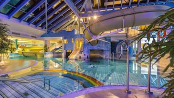 Swimmers can enjoy the pool surrounded by unique geometric shapes and a large slide.