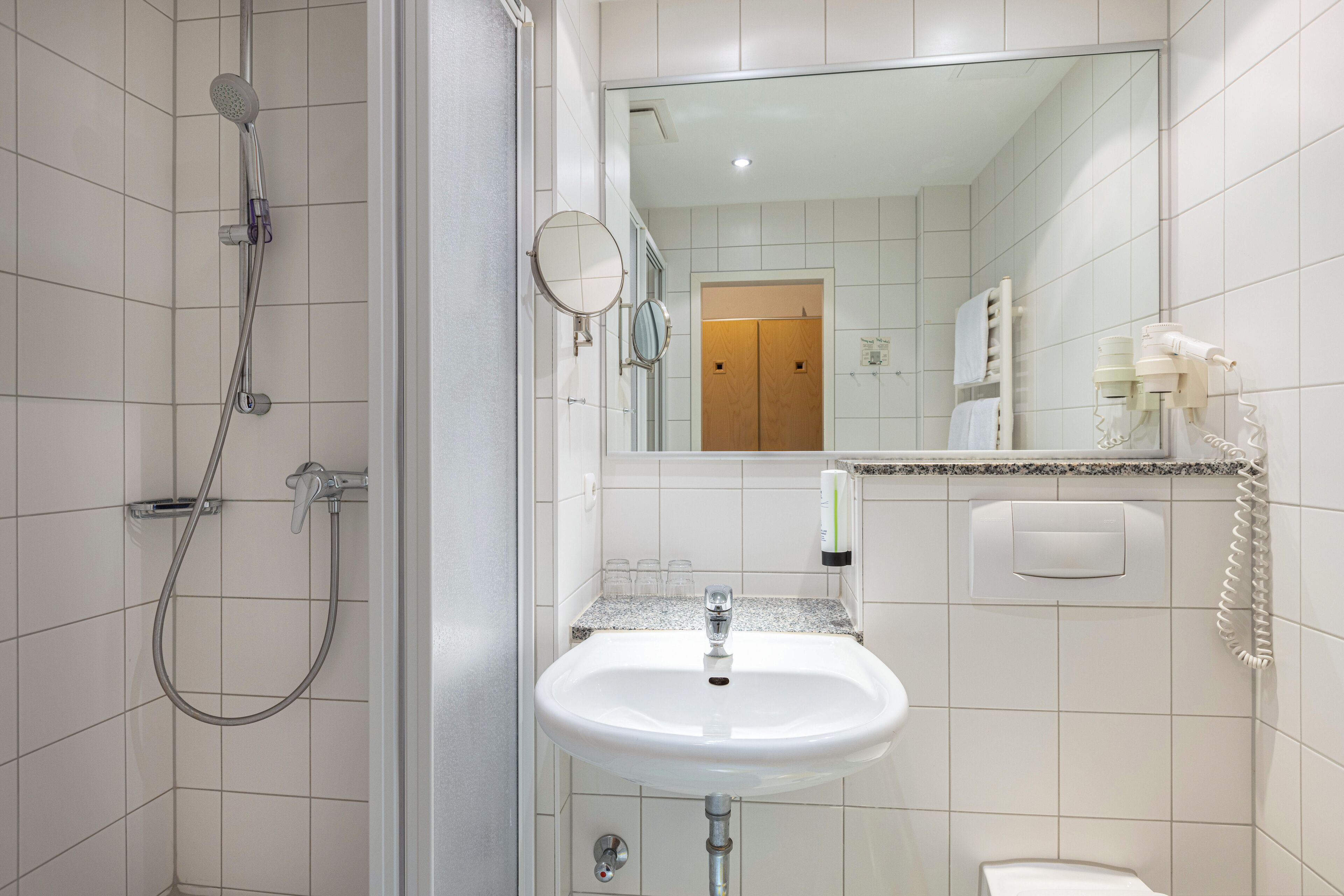 standard double room | bathroom | shower, hair dryer, towels