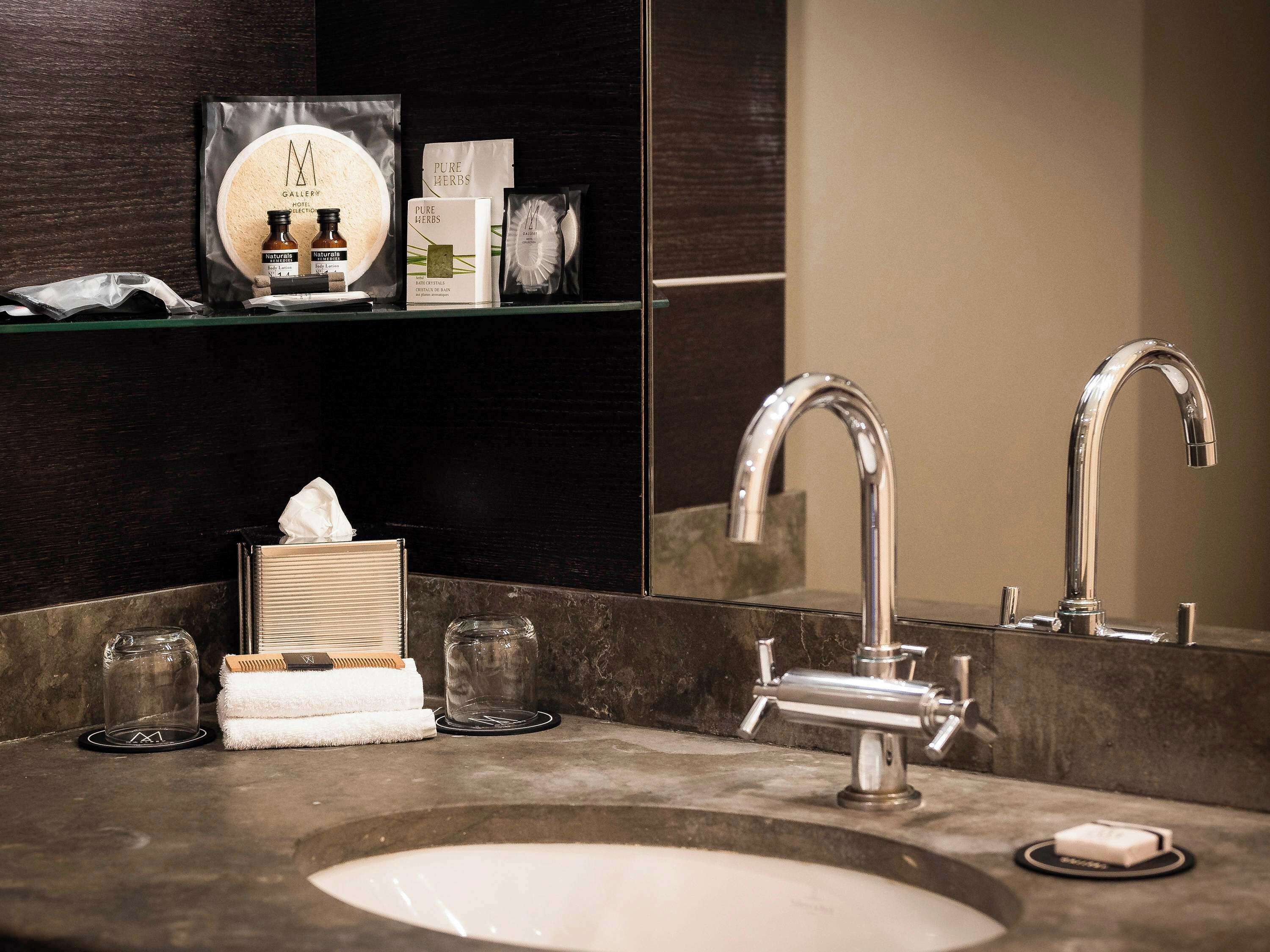 designer toiletries, hair dryer, bathrobes, slippers