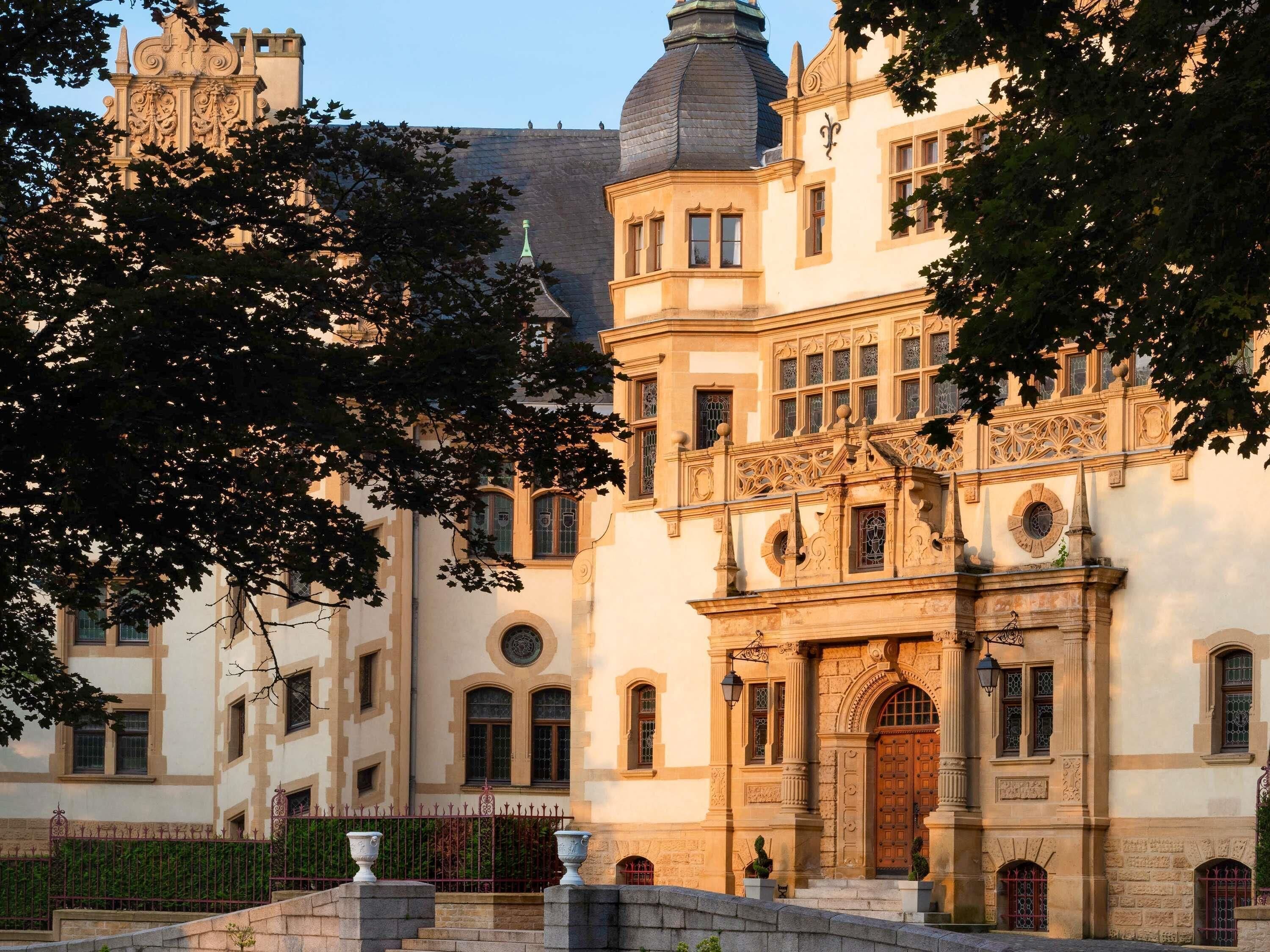 A historic building with ornate architecture, including a prominent entrance and decorative windows.