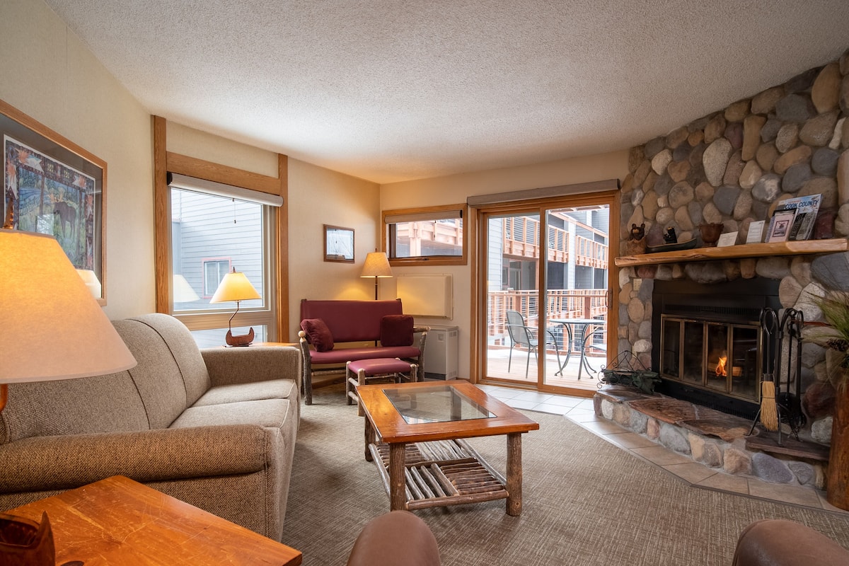 Villager Condo | Living area | Flat-screen TV, table tennis, books, video library