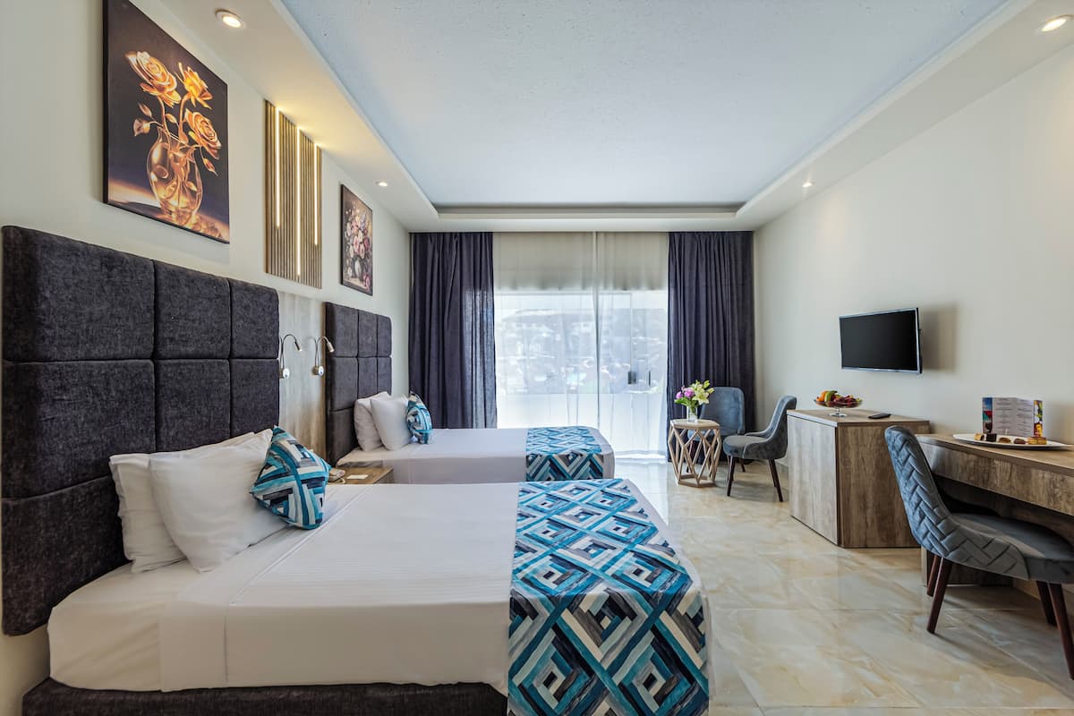 Standard Triple Room, 1 Bedroom, Pool View | Minibar, in-room safe, blackout drapes, bed sheets