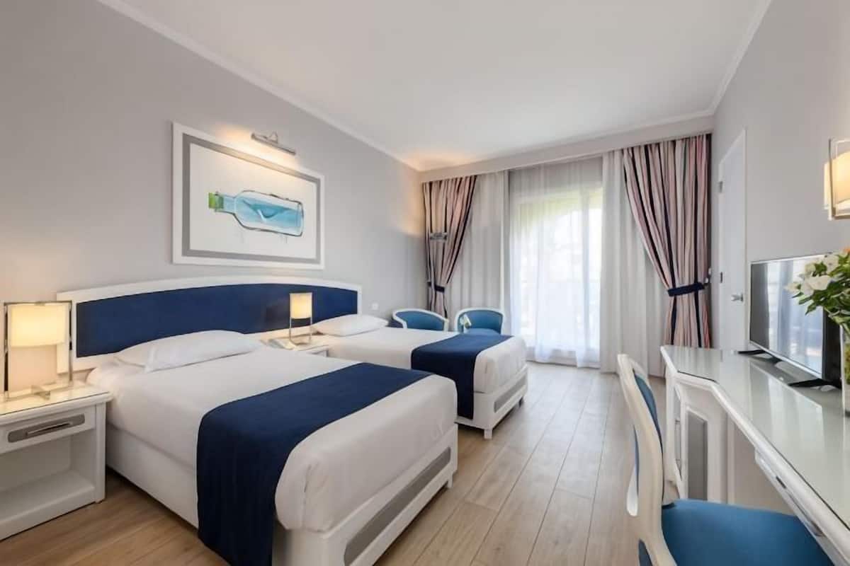 In-room safe, desk, blackout curtains, iron/ironing board (on request)