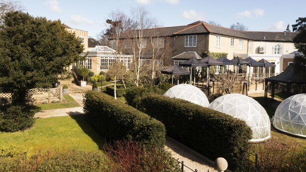 A garden with a conservatory, a gazebo, and several dome-shaped structures. - Ivy Hill Hotel, BW Signature Collection (Ingatestone)