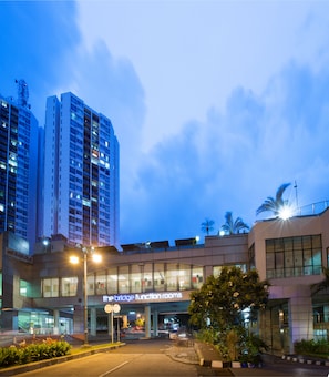 A modern hotel with a prominent entrance labeled "The Bridge Function Rooms."