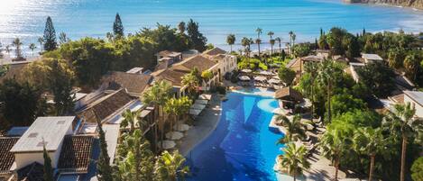 Indoor pool, 2 outdoor pools, open 9:00 AM to 7:00 PM, pool umbrellas