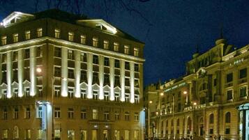 A large, well-lit building with multiple floors and a prominent entrance.