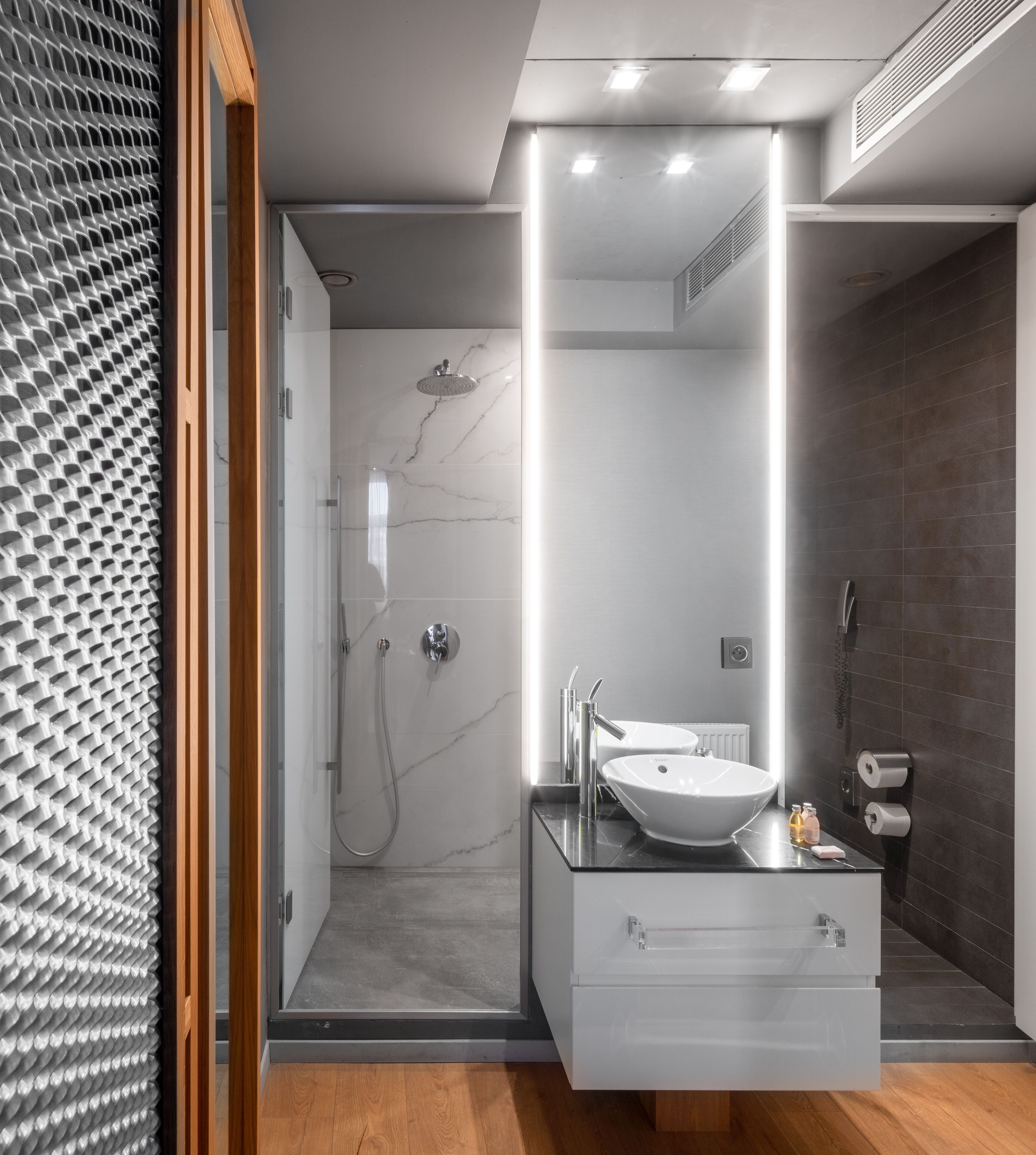 designer toiletries, hair dryer, towels