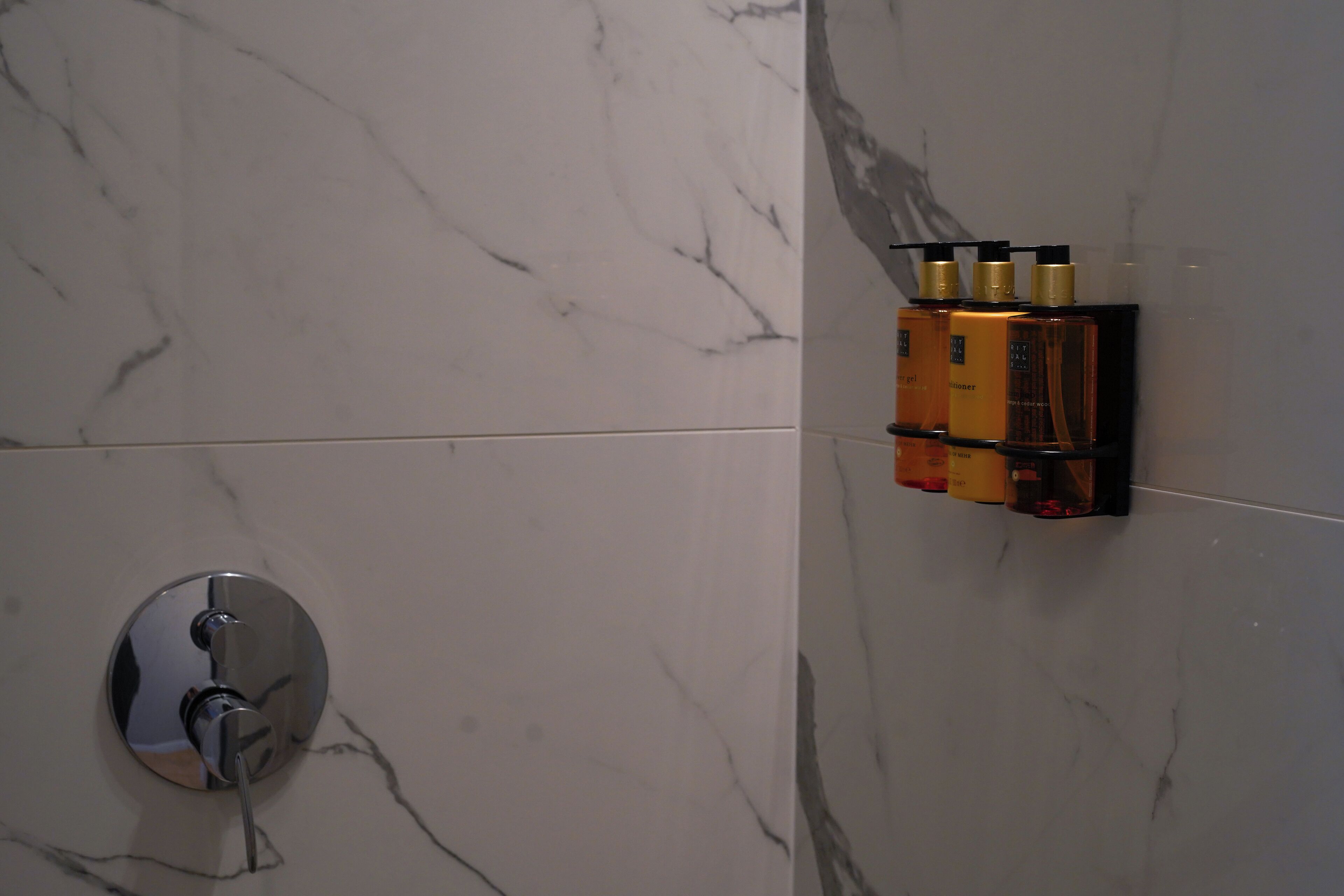 designer toiletries, hair dryer, towels