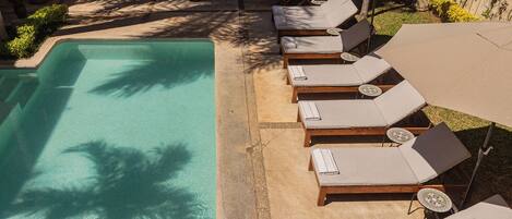 Outdoor pool, open 9:00 AM to 9:00 PM, pool loungers
