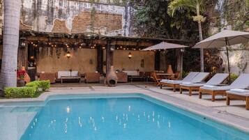 Outdoor pool, open 9:00 AM to 9:00 PM, pool loungers