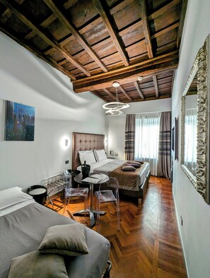 Triple Room, City View | Minibar, in-room safe, desk, blackout drapes