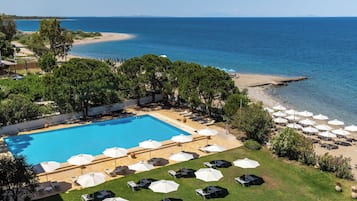 Seasonal outdoor pool, open 11:00 AM to 7:00 PM, pool umbrellas