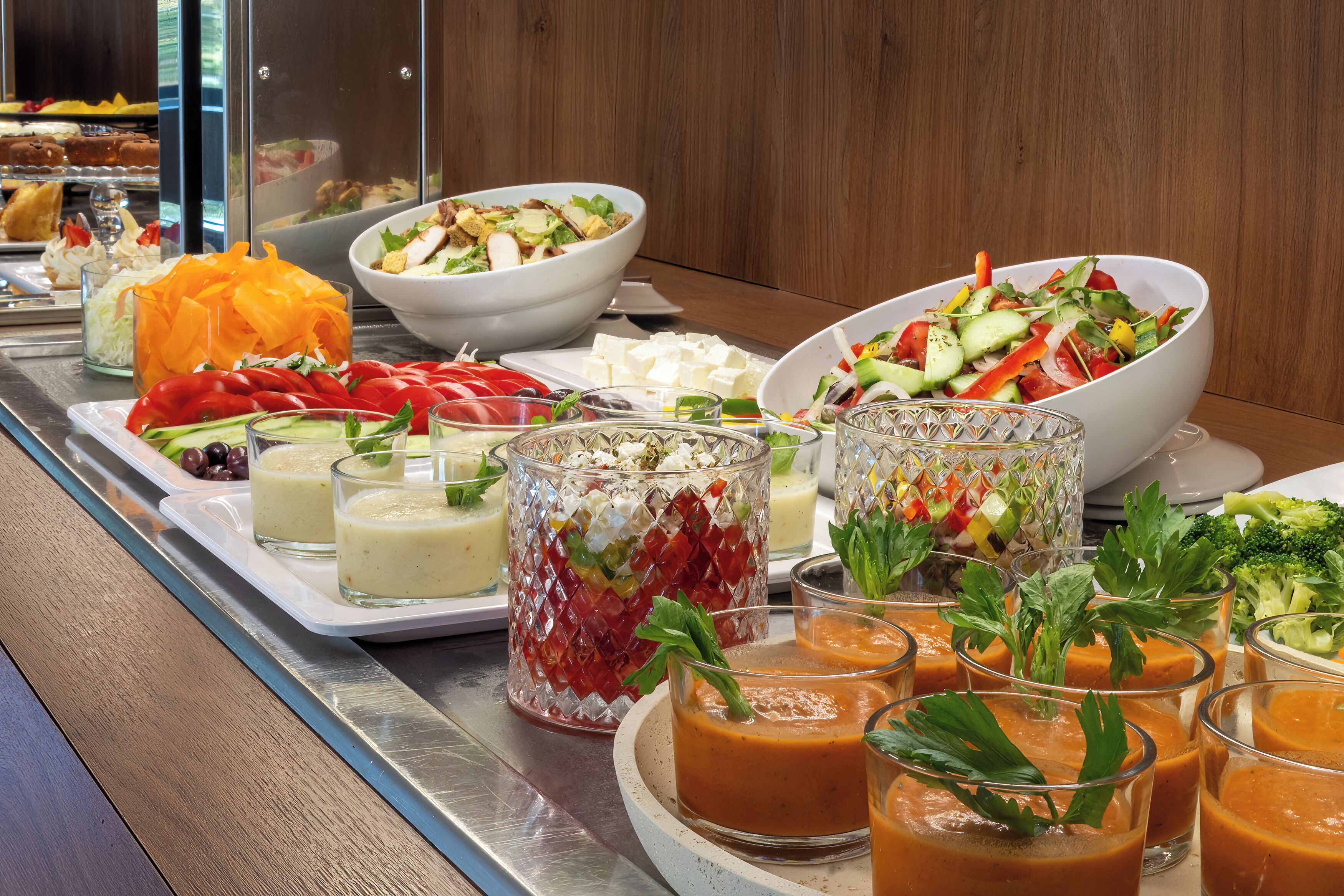 A buffet with various dishes and drinks.