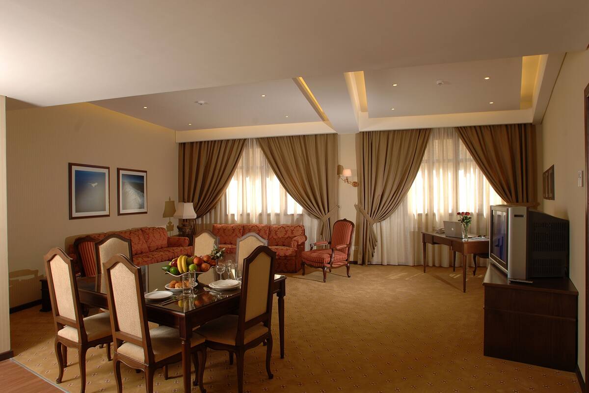 Suite, 2 Bedrooms | Living room | 46-inch LED TV with satellite channels, Smart TV, DVD player