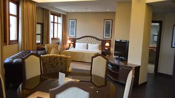 Deluxe Suite | Living area | 46-inch LED TV with satellite channels, Smart TV, DVD player