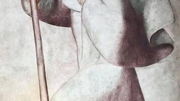 A painting of a figure holding a staff, with a plain background.