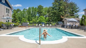 Seasonal outdoor pool, open 8:00 AM to 10:00 PM, pool umbrellas