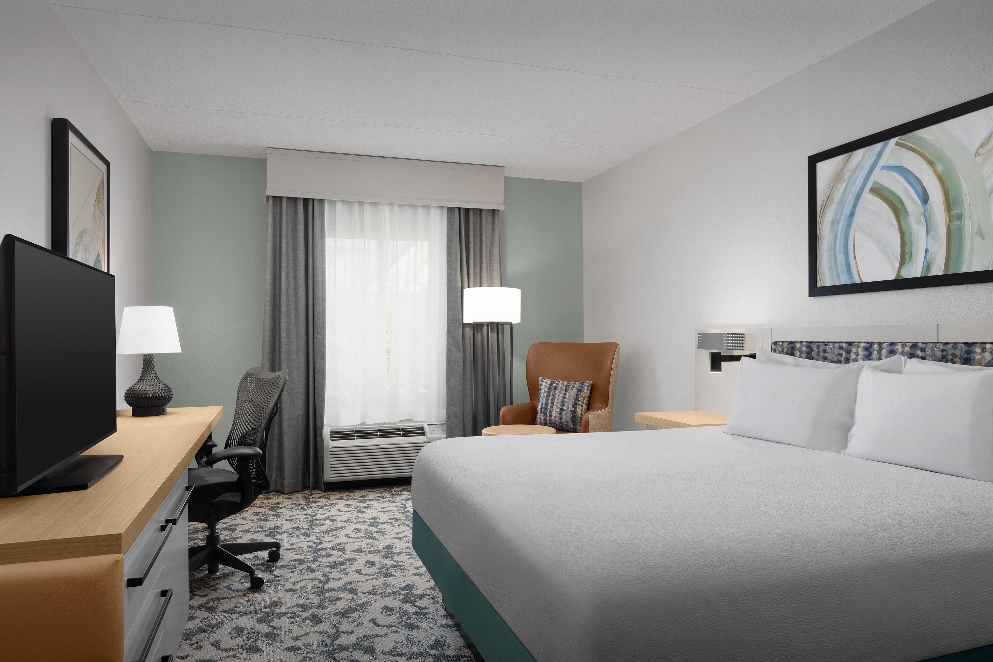 one king bed evolution room | 1 bedroom, desk, laptop workspace, blackout curtains