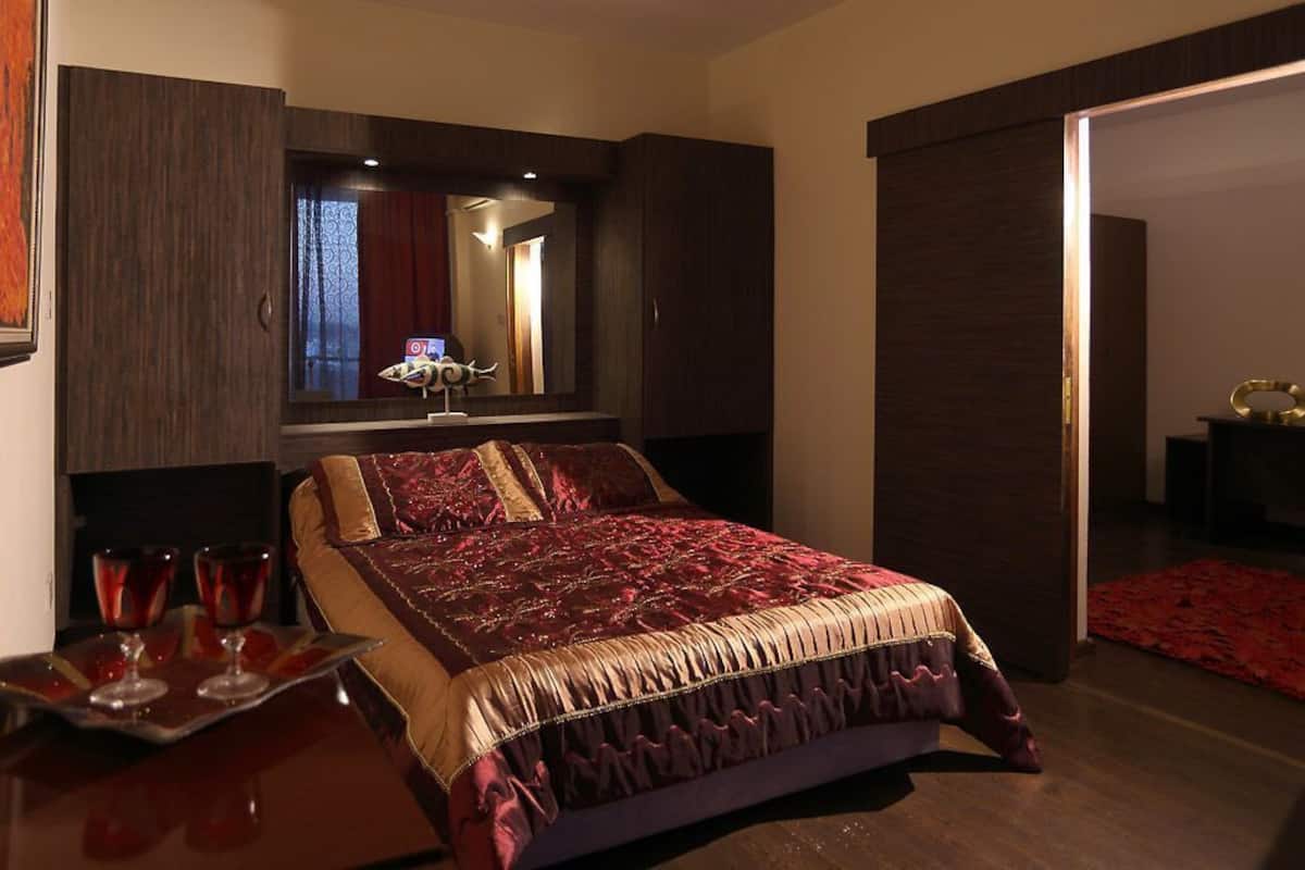 Desk, blackout drapes, bed sheets