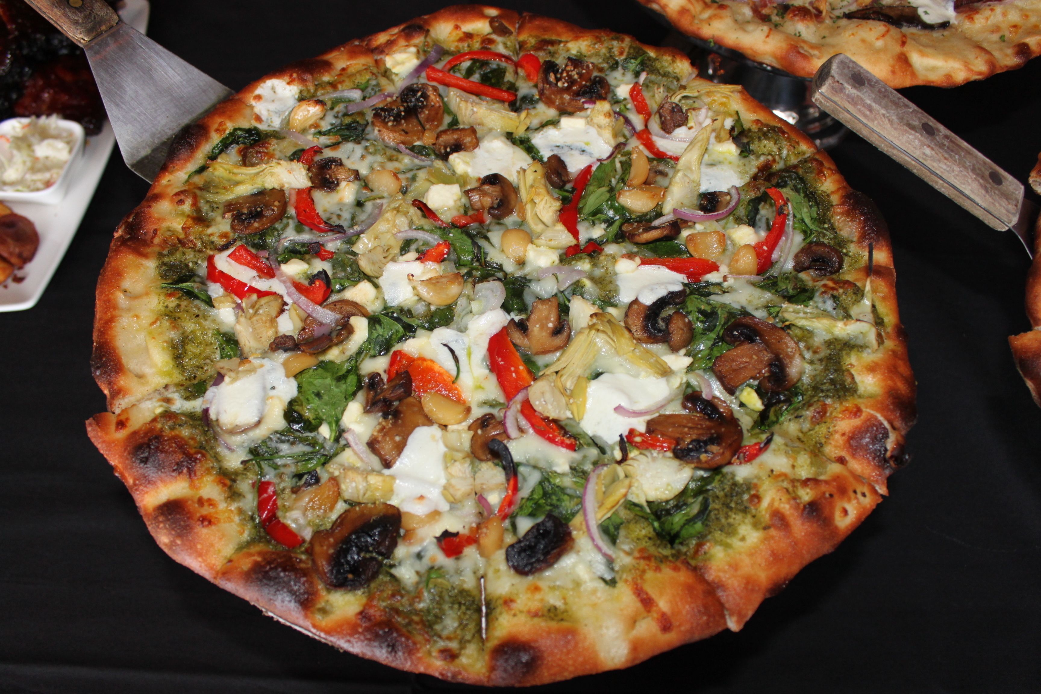 A pizza with various toppings.