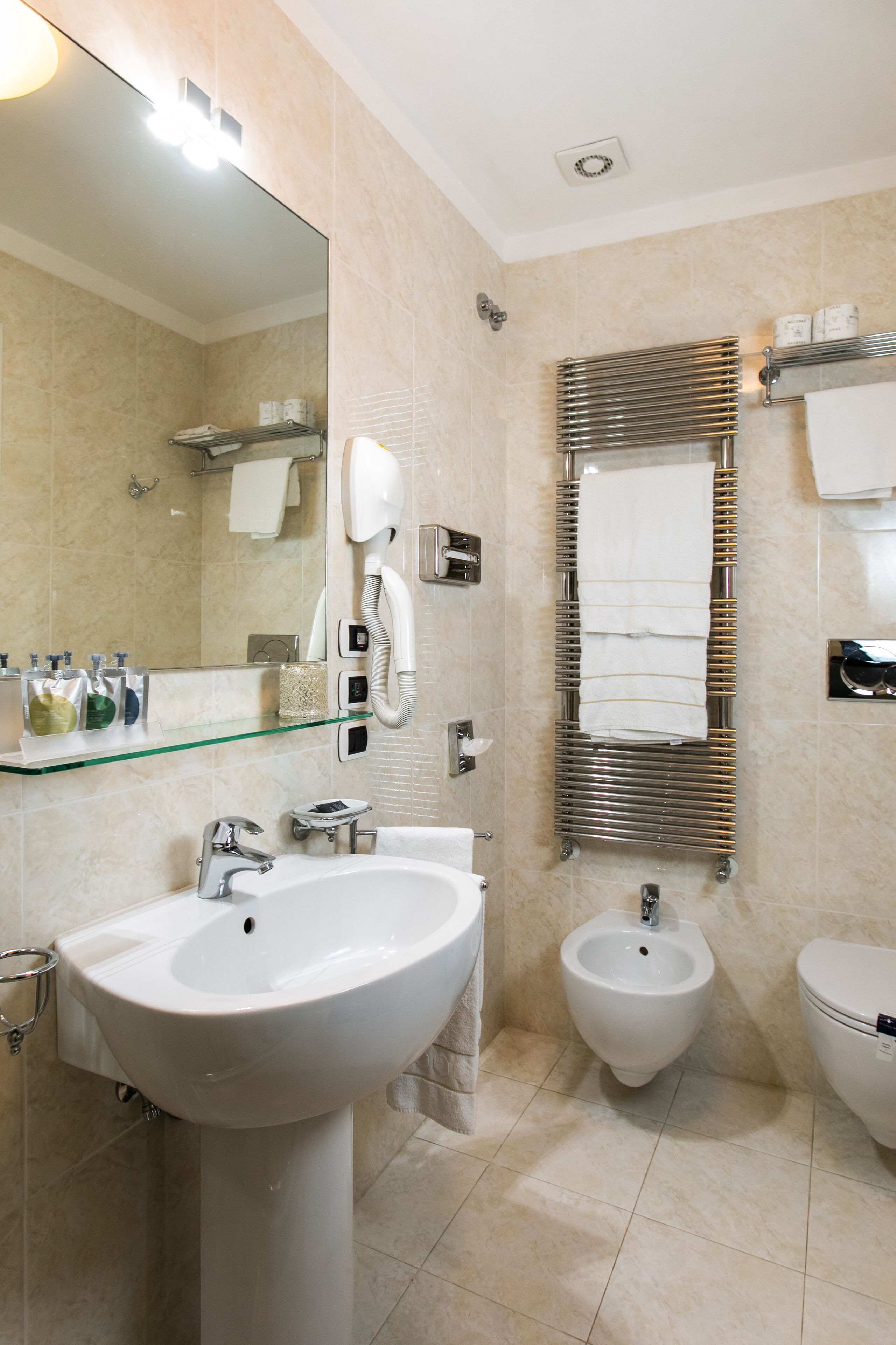 free toiletries, hair dryer, bidet, towels