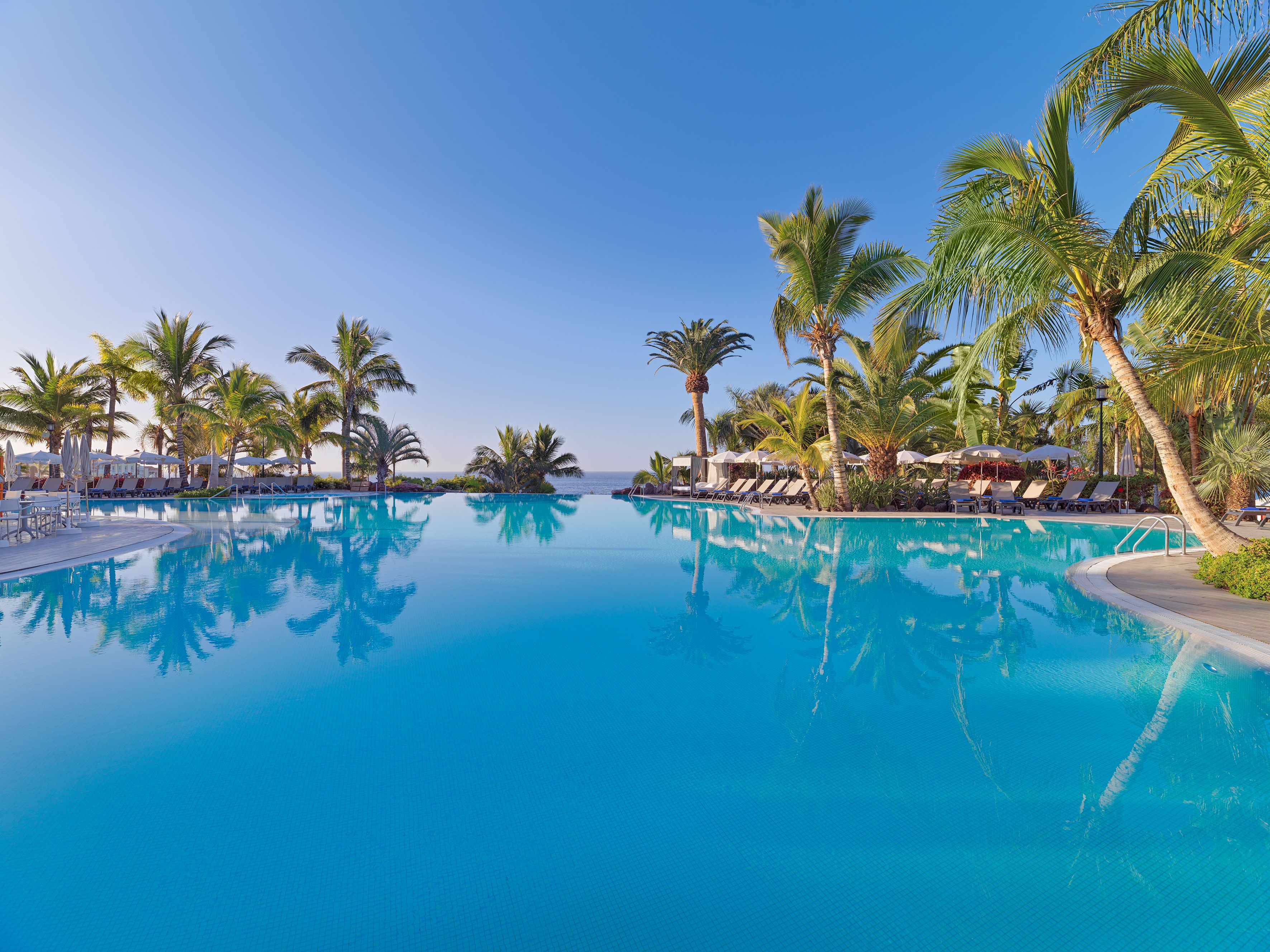 2 outdoor pools, pool umbrellas, pool loungers