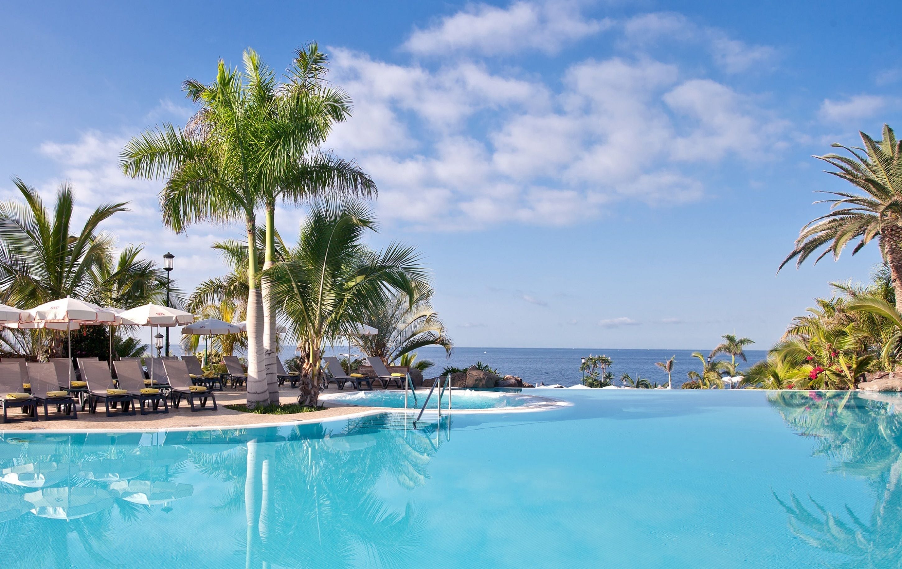 2 outdoor pools, pool umbrellas, pool loungers