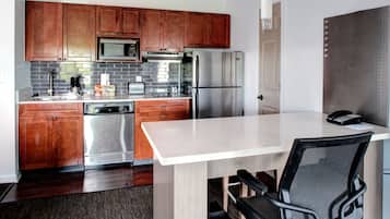 Fridge, microwave, coffee/tea maker, cookware/dishes/utensils