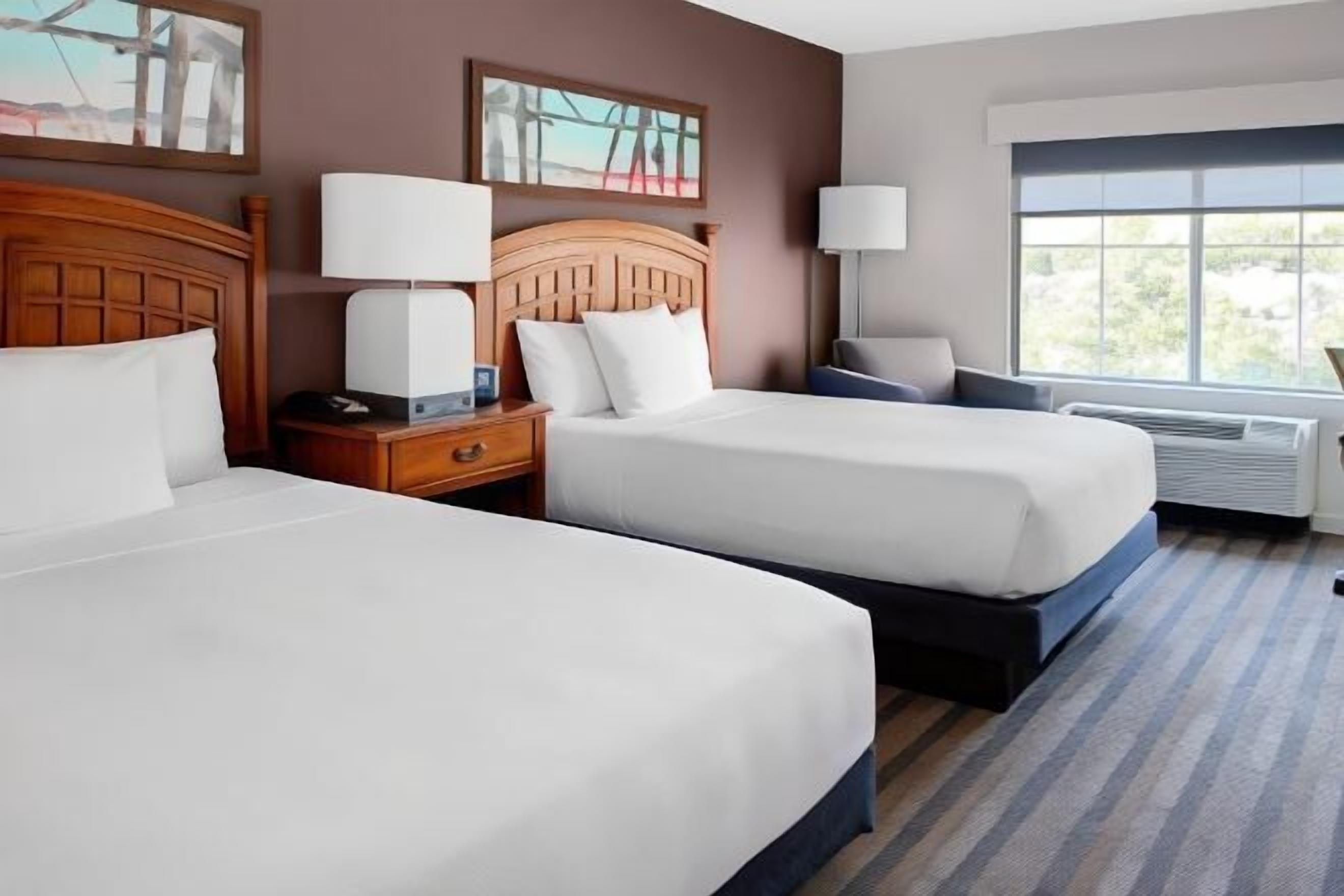 Premium bedding, pillow-top beds, desk, laptop workspace