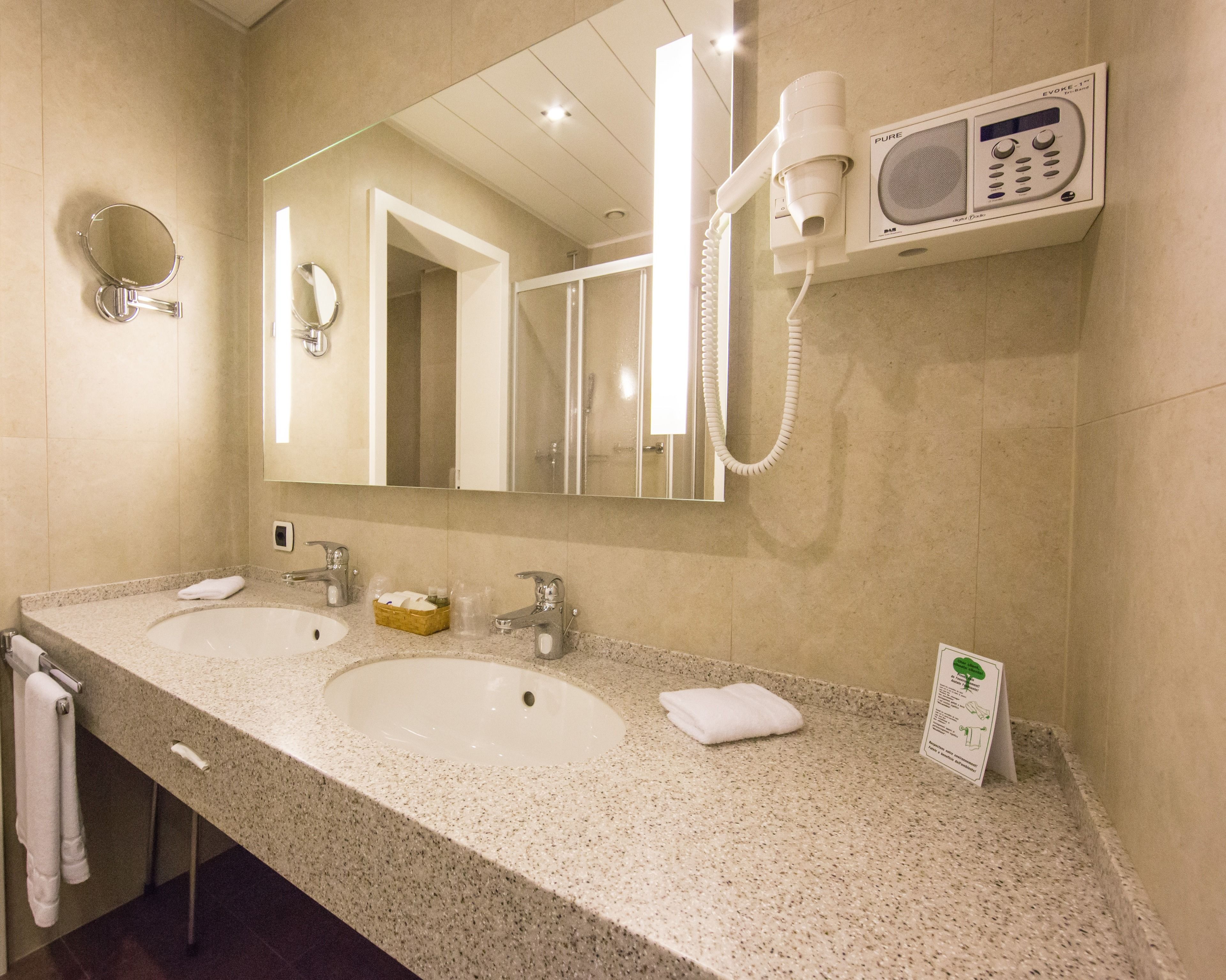 standard double room single use | bathroom | combined shower/bathtub, designer toiletries, hair dryer, dressing gowns