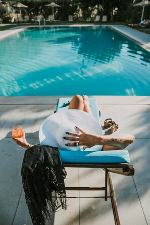 Seasonal outdoor pool, open 6:00 AM to 11:30 PM, pool umbrellas
