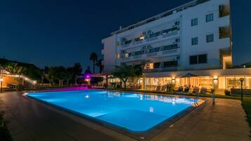 Seasonal outdoor pool, open 6:00 AM to 11:30 PM, pool umbrellas