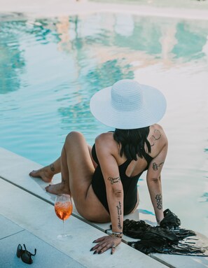 Seasonal outdoor pool, open 6:00 AM to 11:30 PM, pool umbrellas