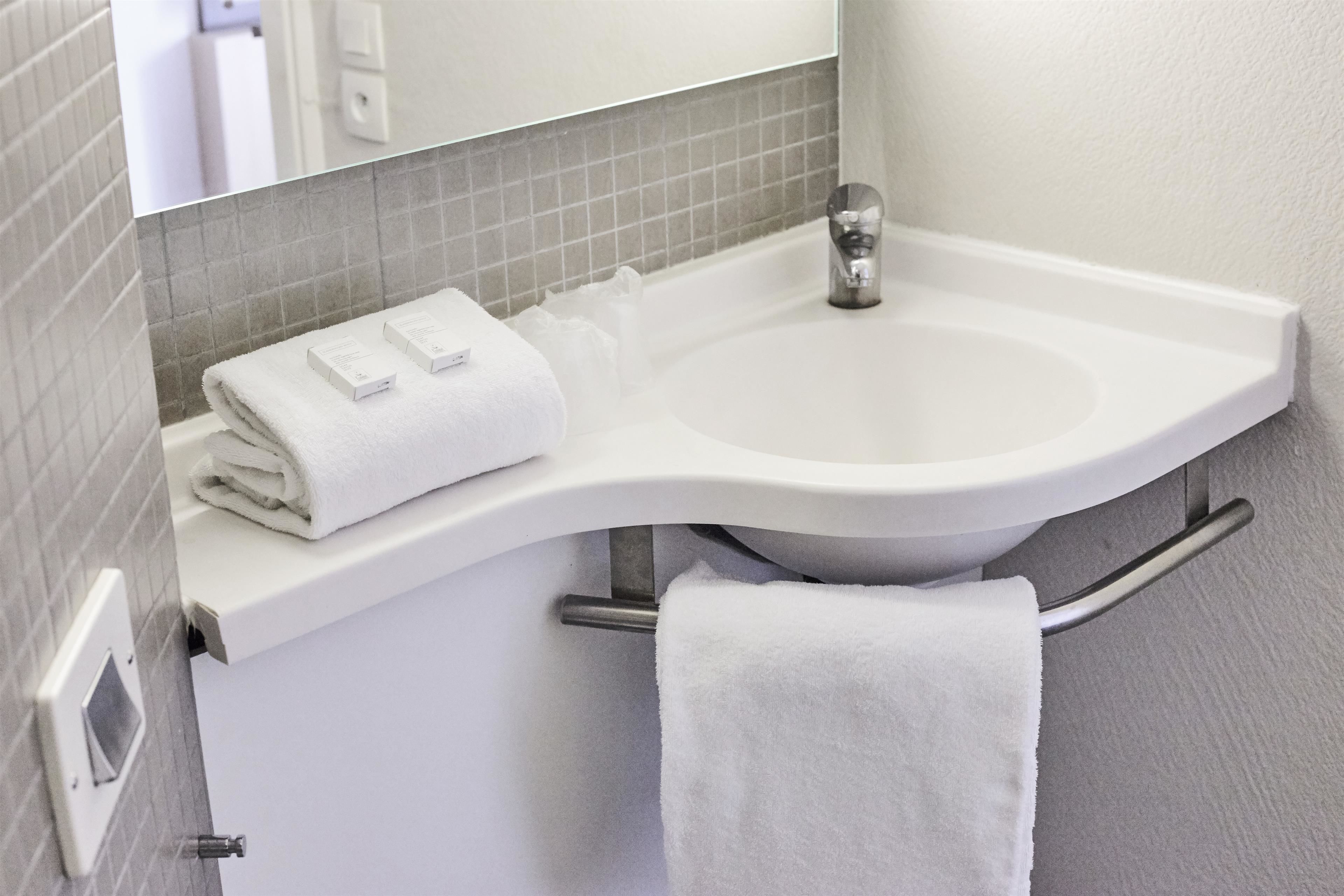 shower, eco-friendly toiletries, hair dryer, towels