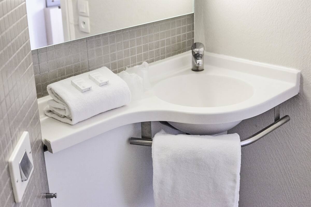 shower, eco-friendly toiletries, hair dryer, towels